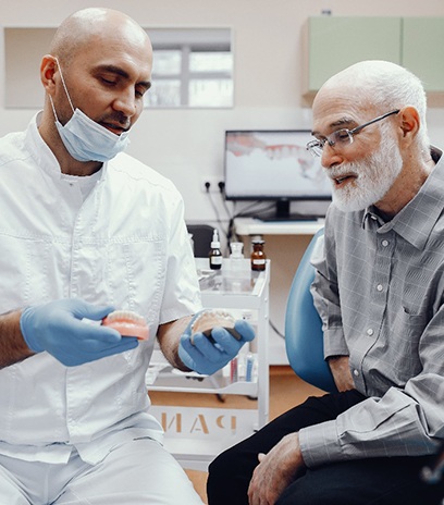 An older man happy with his all-on-4 implants