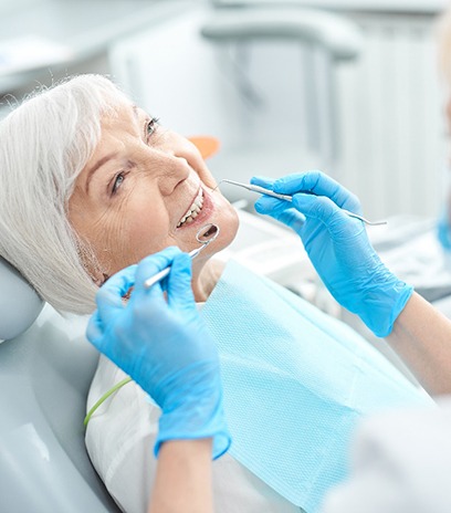 An older man happy with his all-on-4 implants