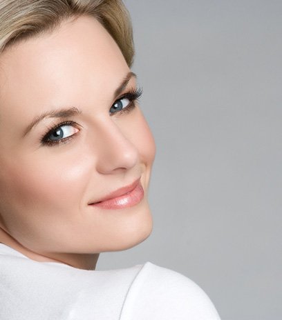 Blonde woman looking back and smiling