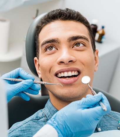 Close-up of mouth during dental checkup and cleaning in Belmont, MA