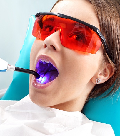 Young girl receiving dental sealants