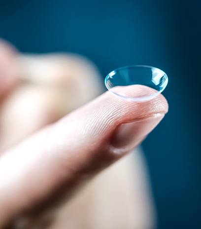 Contact lens on fingertip