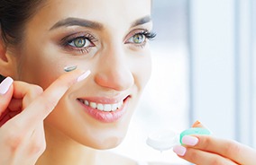 Woman placing contact made for dry eye comfort