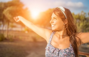 Woman wearing U V inhibiting contact lenses outdoors