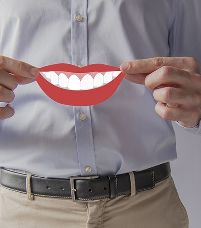 Man at dentist giving thumbs up