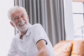 Man with dentures laughing