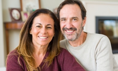 Man and woman with attractive smiles after cosmetic dentistry