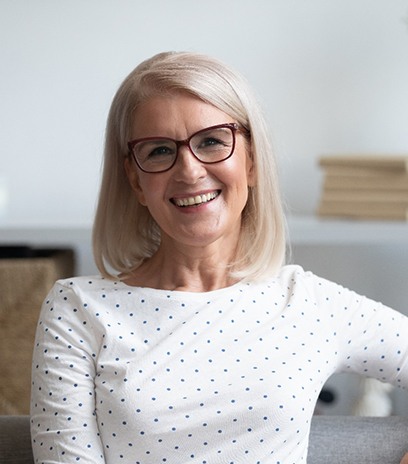 Older woman smiling with dentures