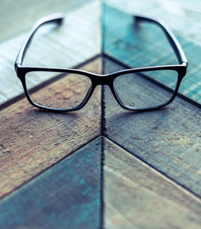 Close-up of glasses with designer frames in Belmont, MA