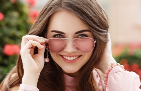 Woman wearing designer aviator glasses