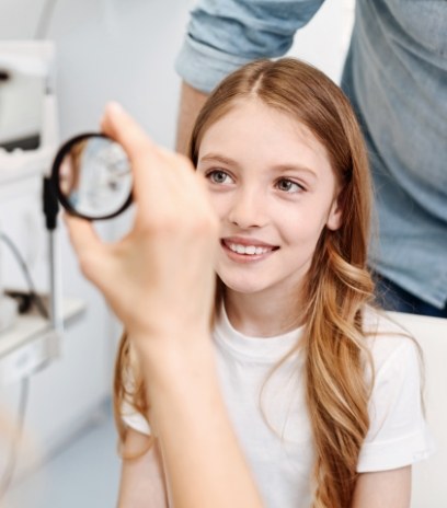 Young girl receiving an eye exam