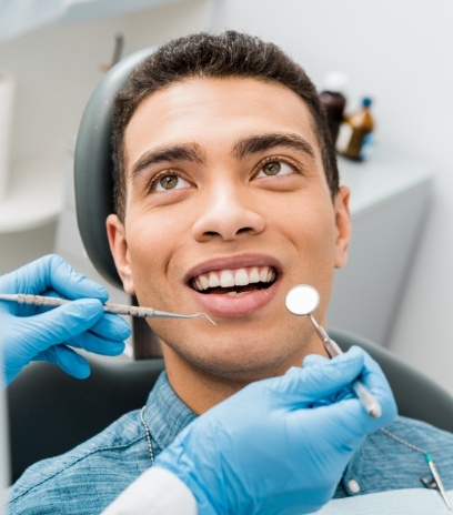 Man receiving a dental exam
