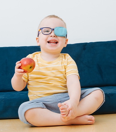 Child with amblyopia wearing an eye patch