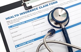 Health insurance claim form with a stethoscope