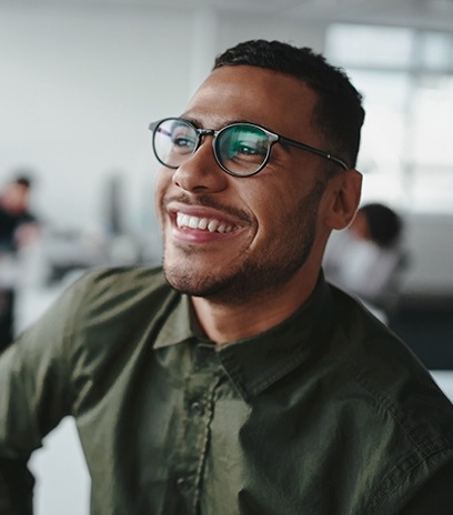 Smiling man new eyeglasses