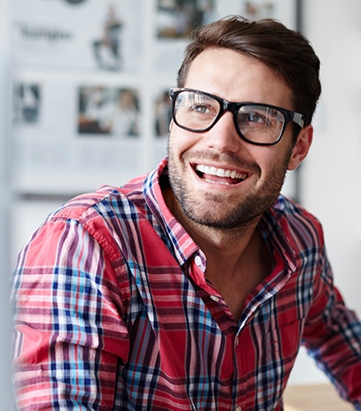 Man wearing eyeglasses with treated lenses