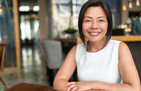 Woman smiling with dental implants in Belmont