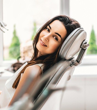 Woman in dental chair smiling