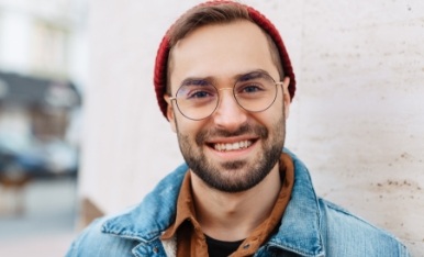 Smiling man wearing glasses