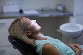 Patient relaxing in dentist's treatment chair