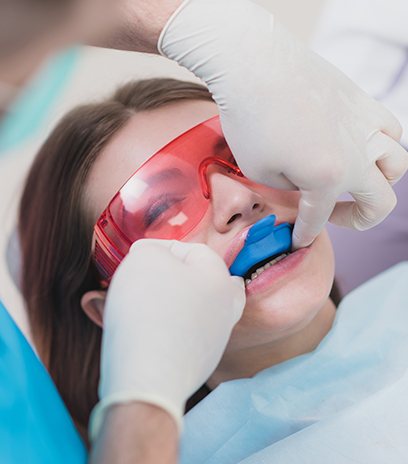 Woman receiving fluoride treatment