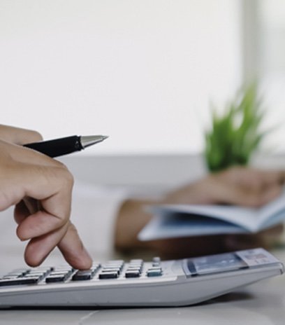 Man using a calculator