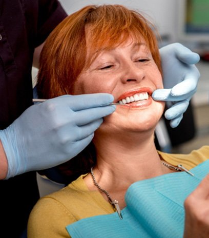 Woman smiling in the dental chair