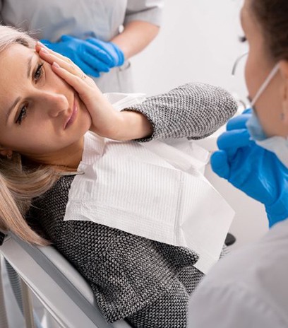 Patient talking to her dental team