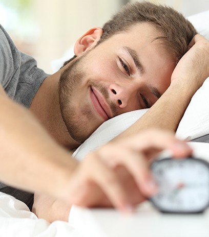 Man waking feeling rested