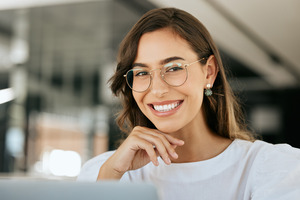 Close-up of woman with glasses smiling